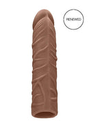 Realrock 7-inch Penis Sleeve in medium skin tone, featuring realistic textures and shapes from Shots Toys, made from body-safe TPE.