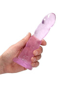 Pink non-realistic dildo with suction cup for anal and vaginal use held in hand - 7 inches from Shots Toys America