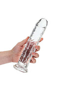 Hand holding 9-inch Realrock Realistic Straight Dildo in crystal clear, offering a transparent view for intimate pleasure.