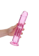 Realrock 10 inch pink realistic straight dildo held in hand for both anal and vaginal stimulation
