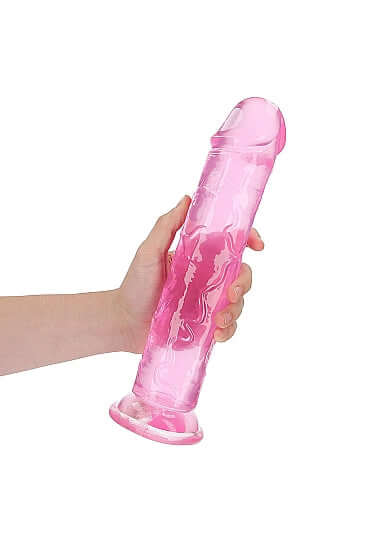Hand holding an elegant pink Realrock Crystal Clear Realistic Dildo, 11 inches, showcasing its transparent design for unique pleasure experiences