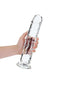 Hand holding an 11-inch Realrock Crystal Clear Dildo from Shots Toys, designed for precise anal and vaginal stimulation.
