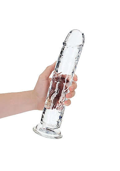 Hand holding an 11-inch Realrock Crystal Clear Dildo from Shots Toys, designed for precise anal and vaginal stimulation.