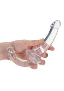 Crystal clear strapless strap-on double dildo held in hand for shared pleasure