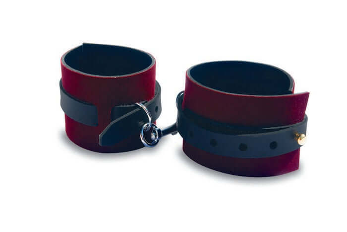 Burgundy velvet bondage cuffs with adjustable straps, ideal for beginners exploring light BDSM play.