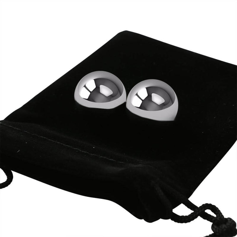 Stainless steel balls on a black pouch, designed for sensual fitness and intimate confidence enhancement.
