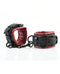 Adjustable faux leather cuffs in red and black for comfortable bondage play with swivel snap clips.