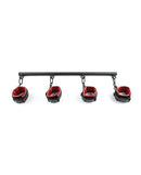 Saffron Spreader Bar and Cuff Set featuring adjustable faux leather cuffs in red and black with swivel snap clips.