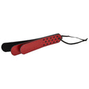 Sportsheets Saffron Layer Paddle in red and black vegan leather, designed for impact play with polka dot detailing.