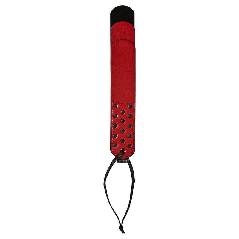 Sportsheets Saffron Layer Paddle in red with black accents, designed for impact play and BDSM adventures.