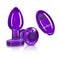 Cheeky Charms Vibrating Metal Plug in purple with remote, featuring tapered design and acrylic gemstone for enhanced pleasure.