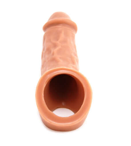 Vixen Creations Colossus in caramel tan, showing the interior and exterior textures of the massive silicone penis sleeve.