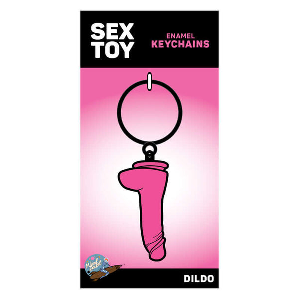 Pink dildo keychain enamel from Wood Rockets in packaging.