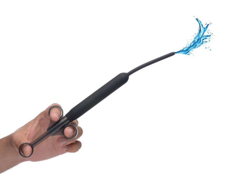 Silicone ribbed lube launcher with flexible hose, showing precise lubrication application in action.