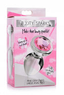 Booty Sparks Pink Gem Glass Anal Plug Large in packaging - crystal clear glass with dazzling pink gem for temperature play.