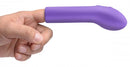 Purple silicone G-Spot pleaser on finger, showcasing curved design and flexible fit for targeted stimulation.