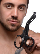 Man holding Master Series Snip Heavy Duty Bondage Scissors by XR Brands
