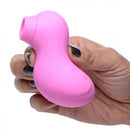 Hand holding Shegasm Sucky Duck Clitoral Stimulator, a pink duck-shaped waterproof suction device.