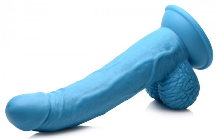 Blue 7.5 inch dildo with realistic balls, veiny shaft, and suction cup base for hands-free or harness play.