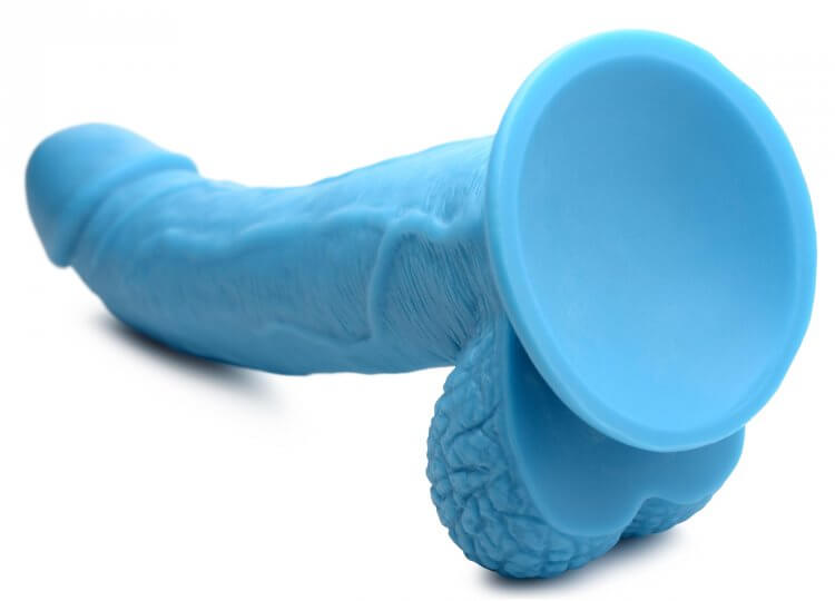 Pop 7.5 inches blue dildo with realistic balls and veiny shaft, suction cup base lying on side, from XR Brands