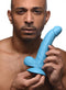 Man holding Pop 7.5 inches blue dildo with balls and suction cup base