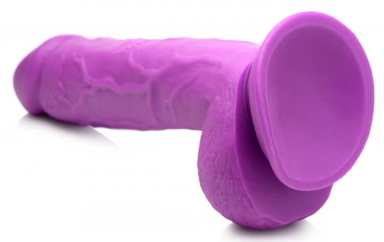 Pop Peckers 8.25-inch purple dildo with suction cup and realistic design for hands-free and strap-on play.
