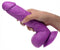 Pop Peckers 8.25-Inch Purple Dildo with realistic balls and suction cup base being held in hand