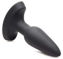 Small black anal plug with tapered design and base for safe insertion.