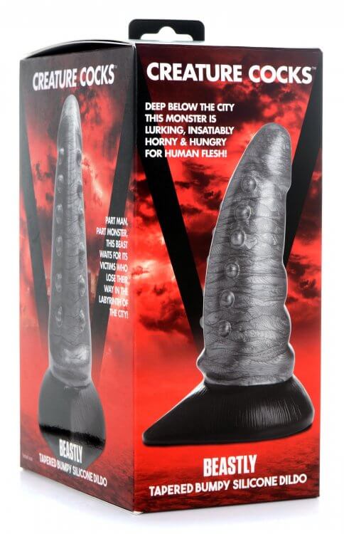 Creature Cocks Beastly Tapered Bumpy Silicone Dildo in packaging with red background and horror-themed graphics.