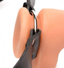Close-up of Master Series Strap and Ride Dildo Strap Harness with metal O-ring attached to silicone strapon dildo from XR Brands.