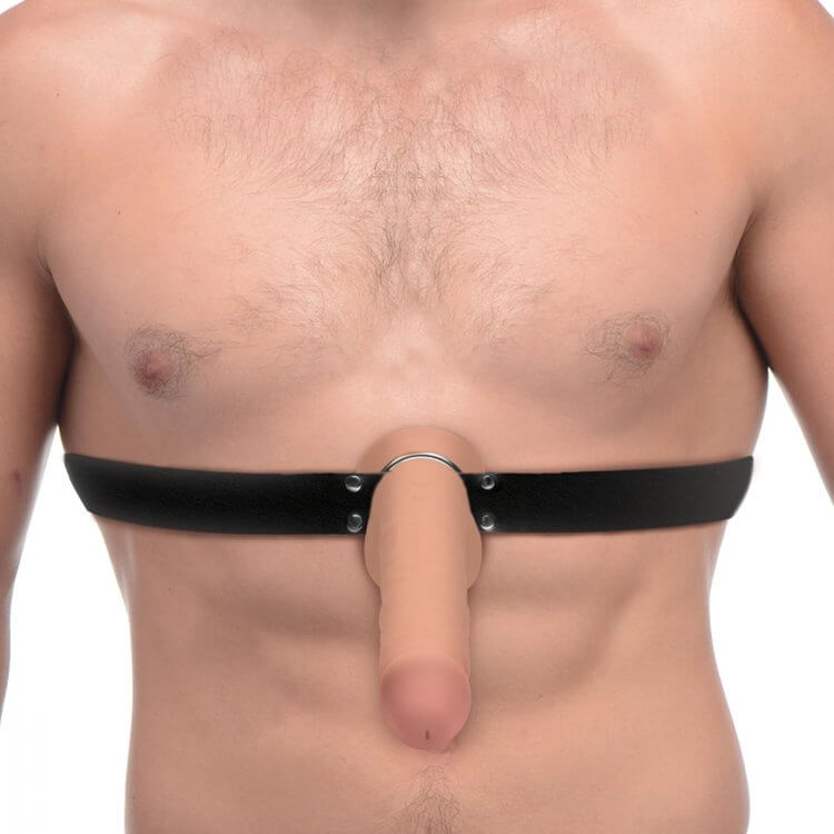Man wearing Master Series Strap and Ride Dildo Strap Harness with a strapon dildo attached