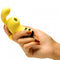 Hand holding the Shegasm Sucky Bee Clit Stimulator Finger Vibe in yellow, showcasing its unique design for pleasure.
