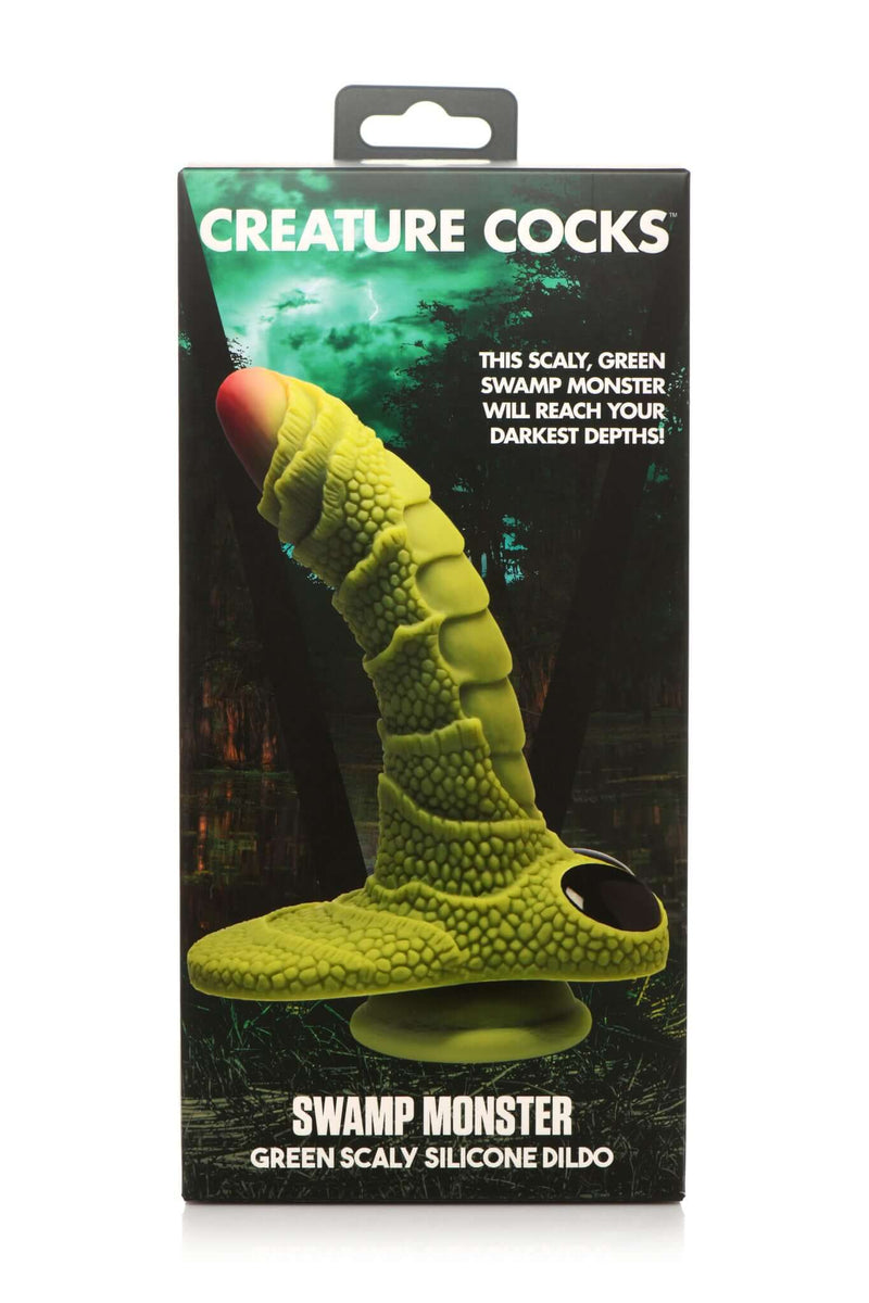 Swamp Monster Silicone Dildo by Creature Cocks in packaging with scaly texture and green color.