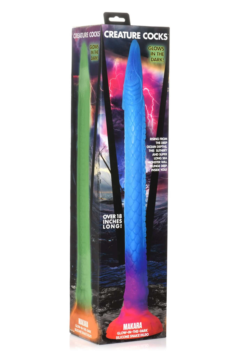 Makara Glow In The Dark Silicone Snake Dildo by Creature Cocks in packaging, showcasing its sea snake design and UV glow feature
