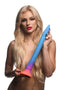 Model holding 16-inch Makara Glow In The Dark Silicone Snake Dildo by Creature Cocks in blue and orange gradient colors.
