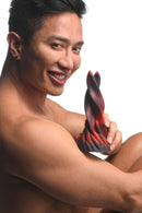 Smiling person holding Creature Cocks Hell Kiss Twisted Silicone Dildo from XR Brands for fantasy roleplay and sensual penetration play