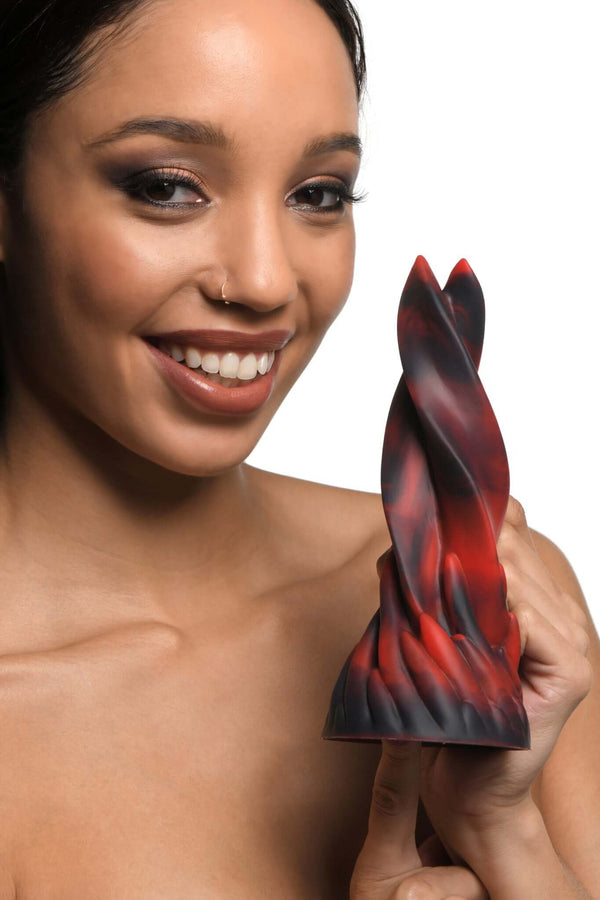 Woman holding Creature Cocks Hell Kiss Twisted Silicone Dildo from XR Brands, featuring a twisted tongue design in red and black.