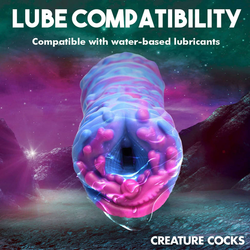 Creature Cocks Cyclone Squishy Alien Vagina Stroker with lube compatibility note in vibrant colors suitable for water-based lubricants.