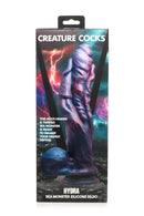 Creature Cocks Hydra Sea Monster Silicone Dildo in packaging, featuring a dark blue and red three-headed design with a mystical purple hue.
