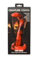 Creature Cocks King Cobra Silicone Dildo packaging with fiery background displaying scaled, snake-like toy from XR Brands.