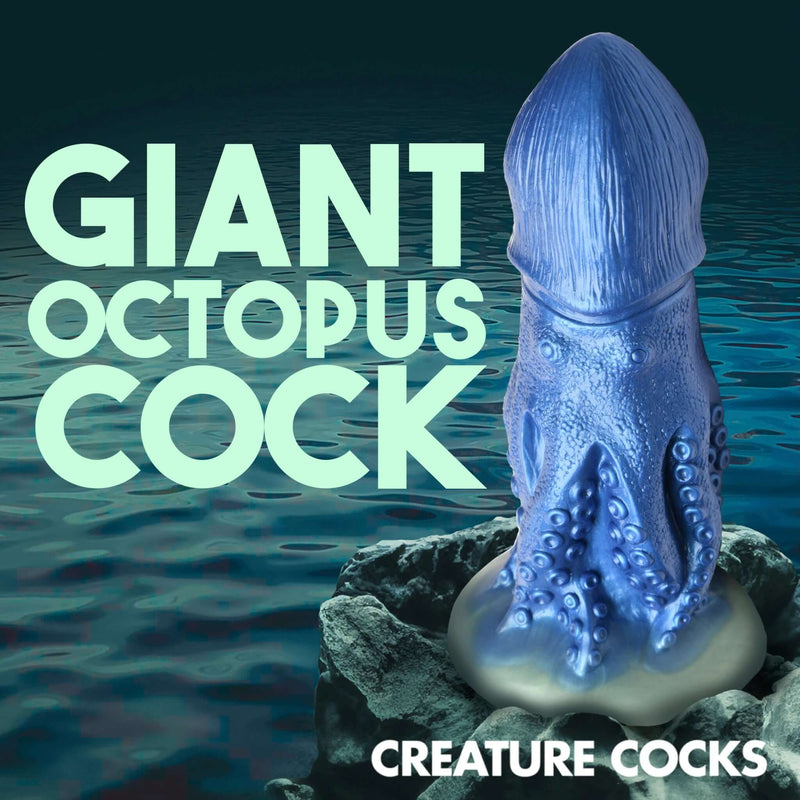 Shimmering blue Creature Cocks Cocktopus silicone dildo by XR Brands with octopus design on rocky ocean background