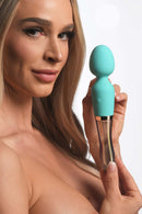 Woman holding Prism Vibra Glass 10X Turquoise Dual Ended Wand by XR Brands