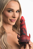 Woman holding Creature Cocks Horny Devil Demon Silicone Dildo from XR Brands