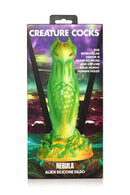 Creature Cocks Nebula Alien Silicone Dildo in green and gold with red eyes by XR Brands in packaging.