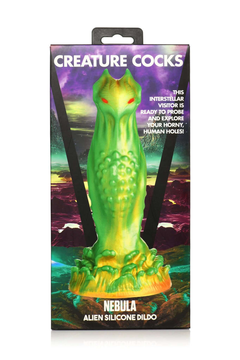 Creature Cocks Nebula Alien Silicone Dildo in green and gold with red eyes by XR Brands in packaging.