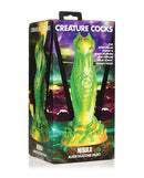 Creature Cocks Nebula Alien Silicone Dildo packaging with green and gold galactic design and mysterious red eyes by XR Brands