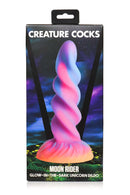 XR Brands Creature Cocks Moon Rider Glow In The Dark Unicorn Dildo in package with vibrant purple, blue, pink, and yellow colors.