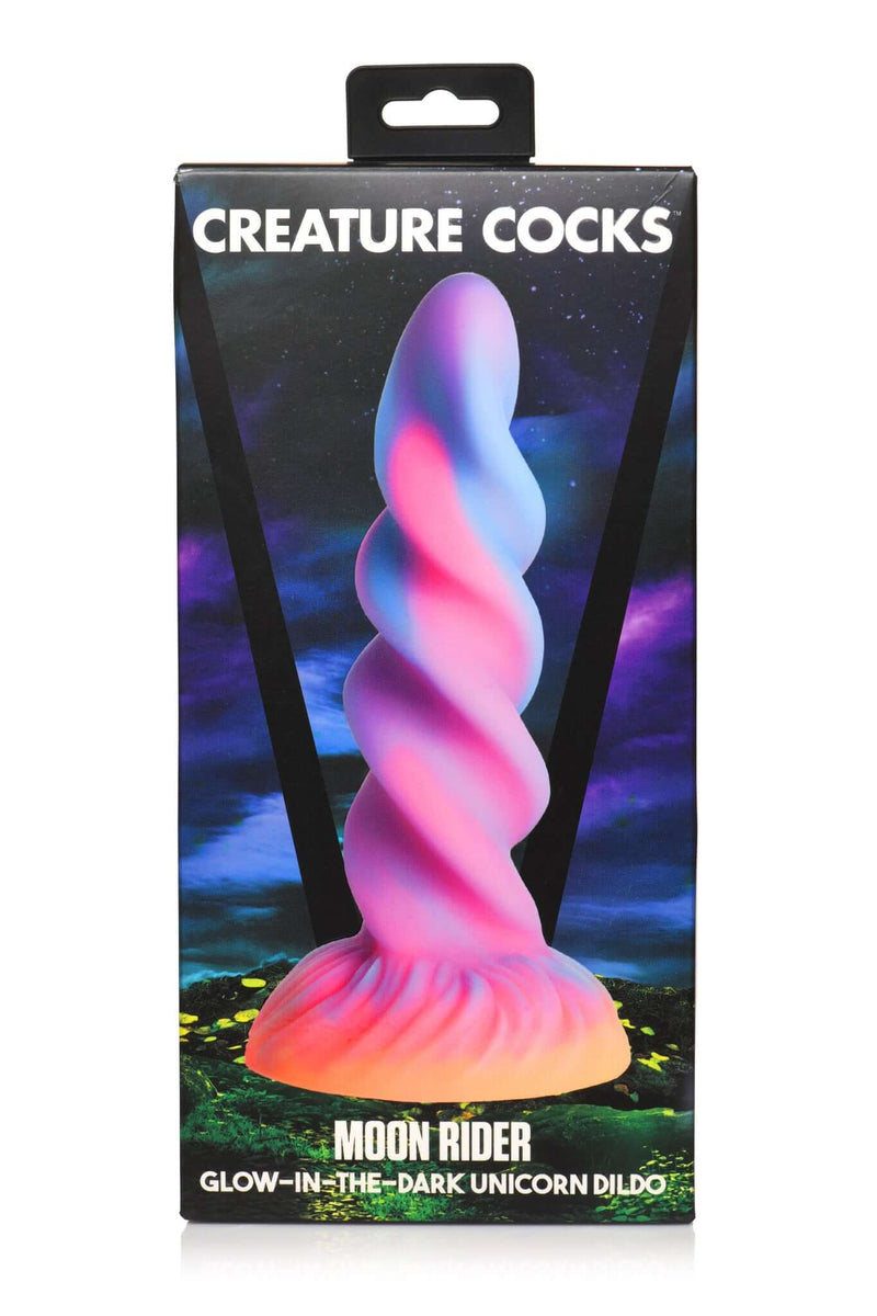 XR Brands Creature Cocks Moon Rider Glow In The Dark Unicorn Dildo in package with vibrant purple, blue, pink, and yellow colors.