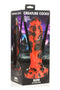 Creature Cocks Reaper Silicone Dildo in packaging against a dark, ominous background