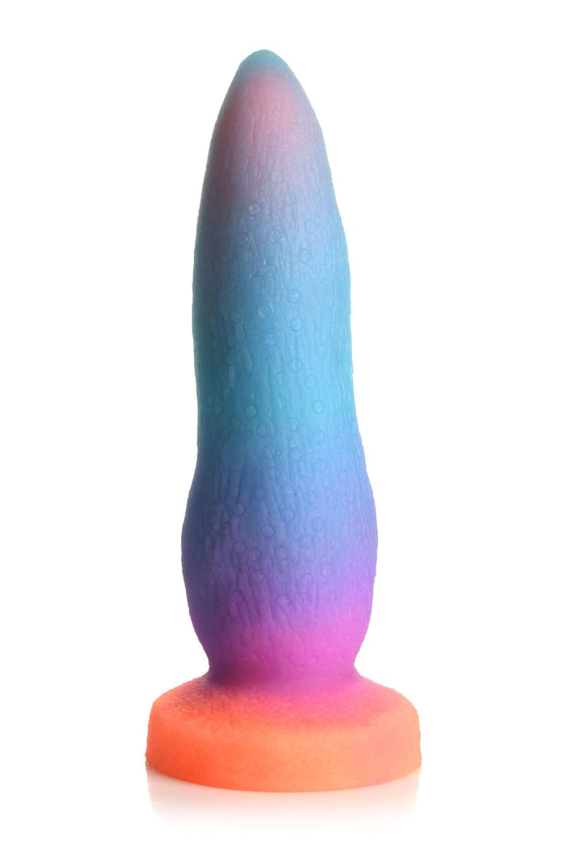 Creature Cocks Luminescent Silicone Dildo by XR Brands in vibrant blue, purple, and pink colors, standing upright.